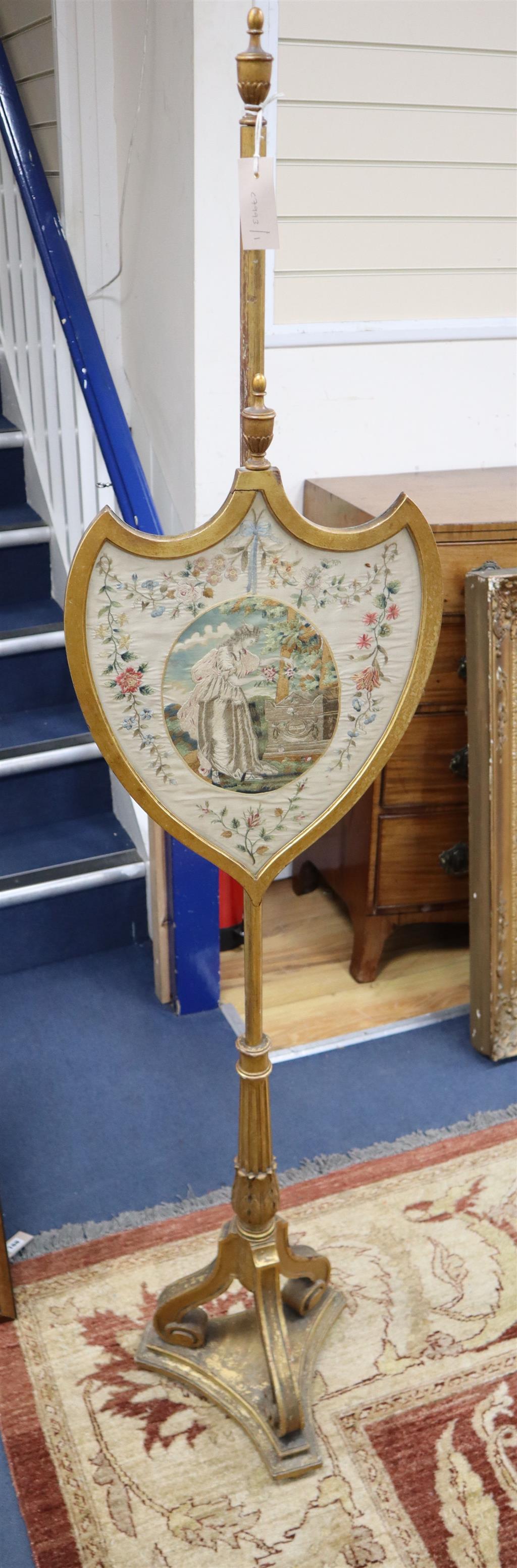 A Regency giltwood pole screen with silkwork banner, height 173cm